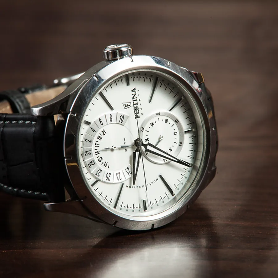 Chronograph watch with a white dial on a black leather strap