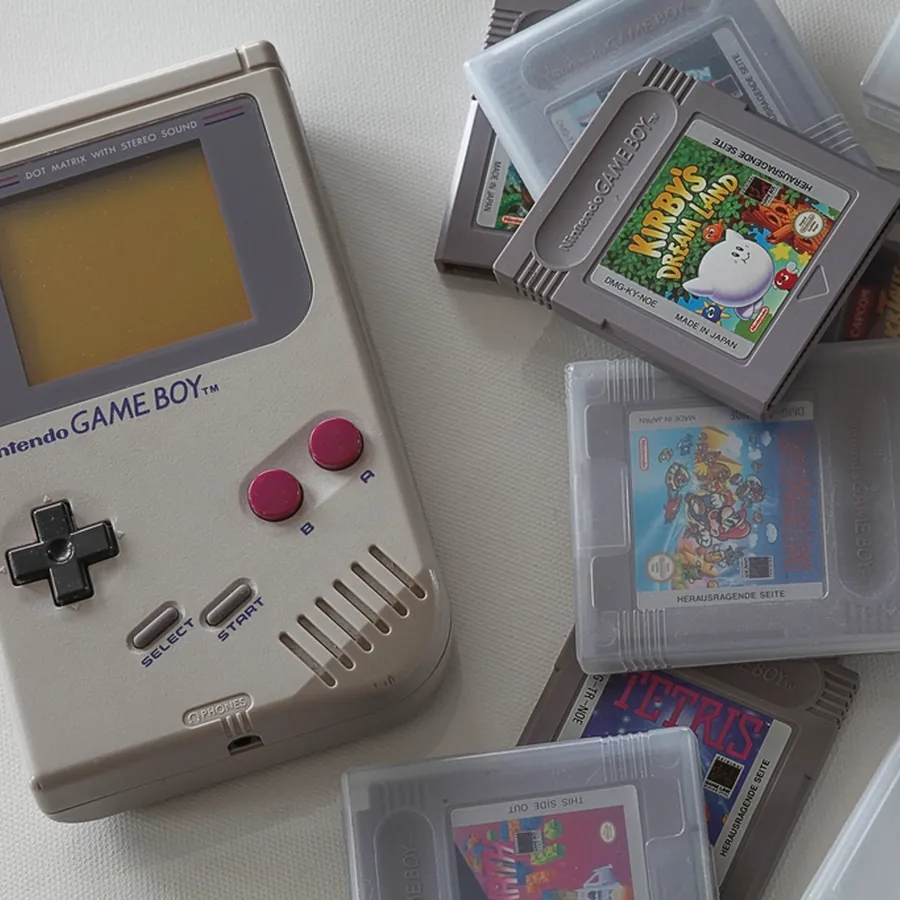 Handheld game console with game cartridges in clear cases