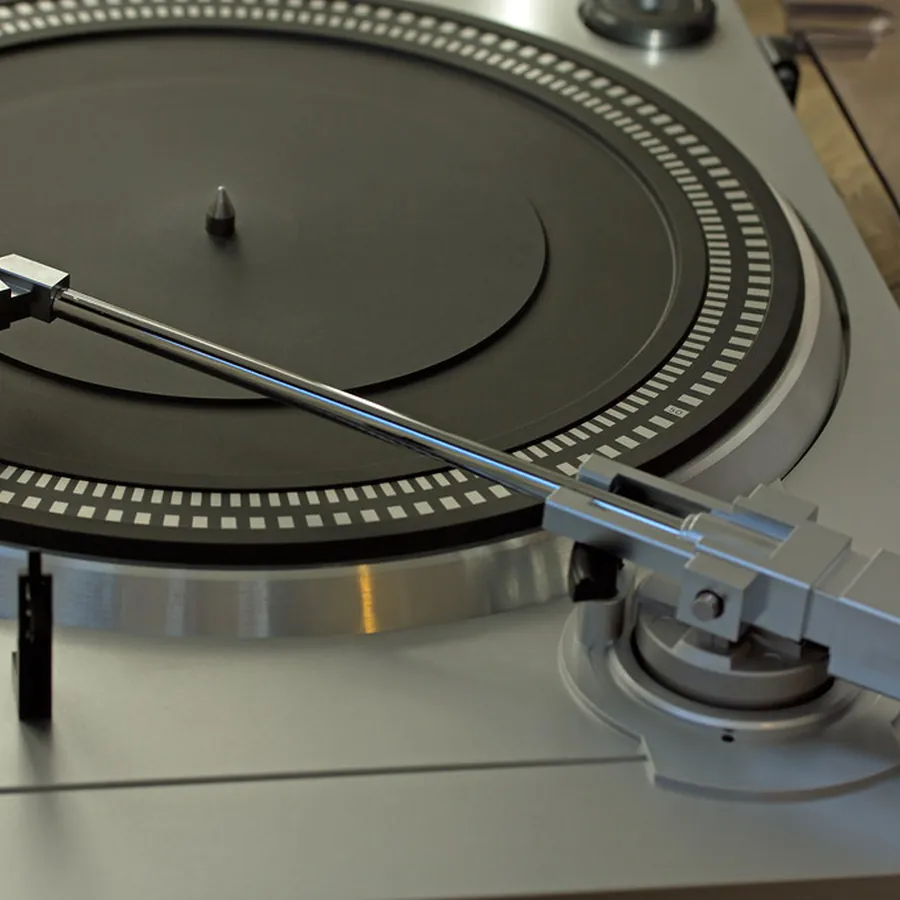 Close-up of a turntable platter and tonearm