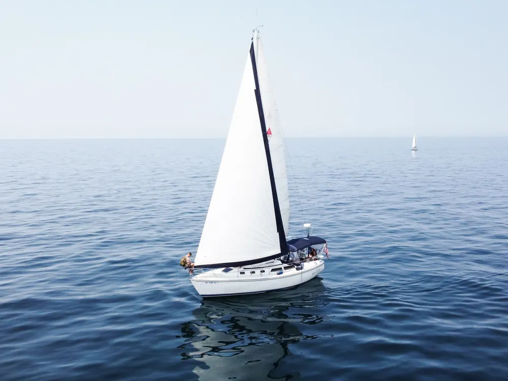 Small sloop on a calm lake