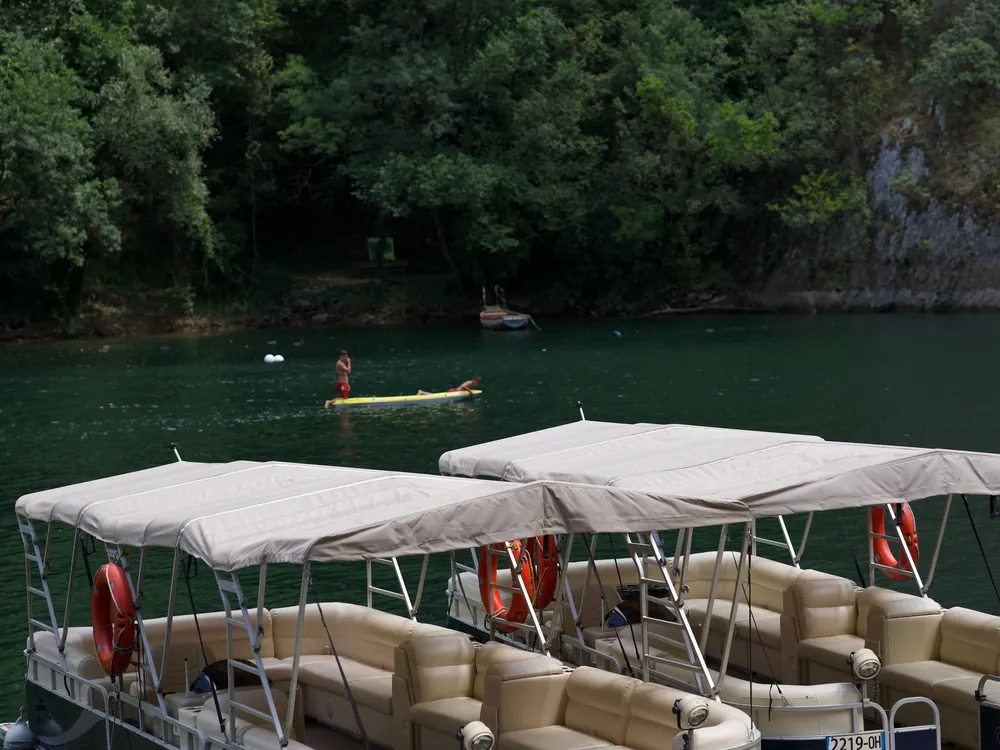 Pontoon boats at a lake dock