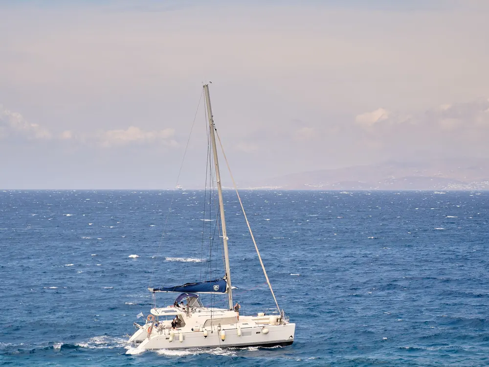 Cruising sailboat on the open sea