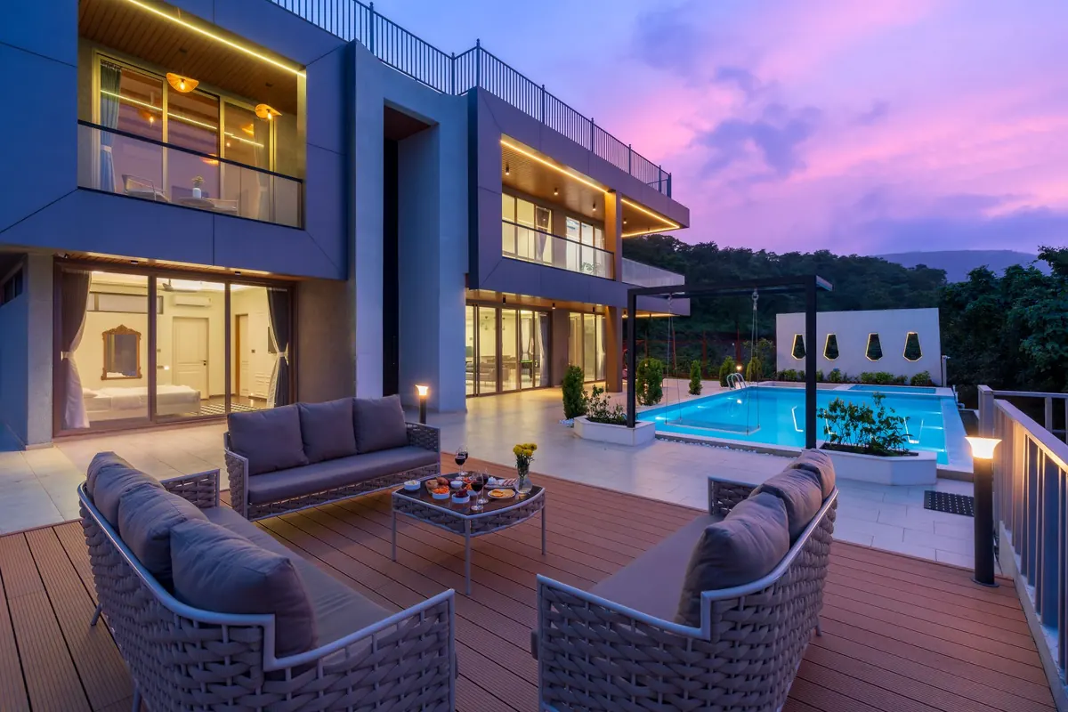 Contemporary home with terraces at dusk