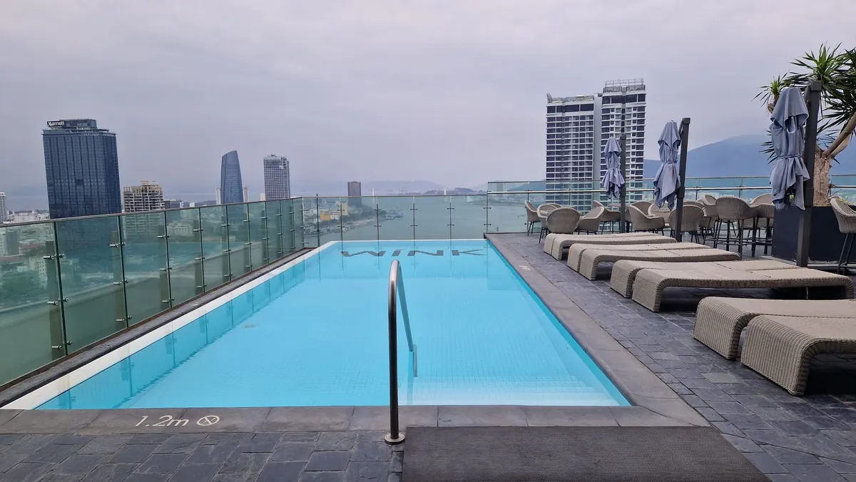 Rooftop pool terrace above the city