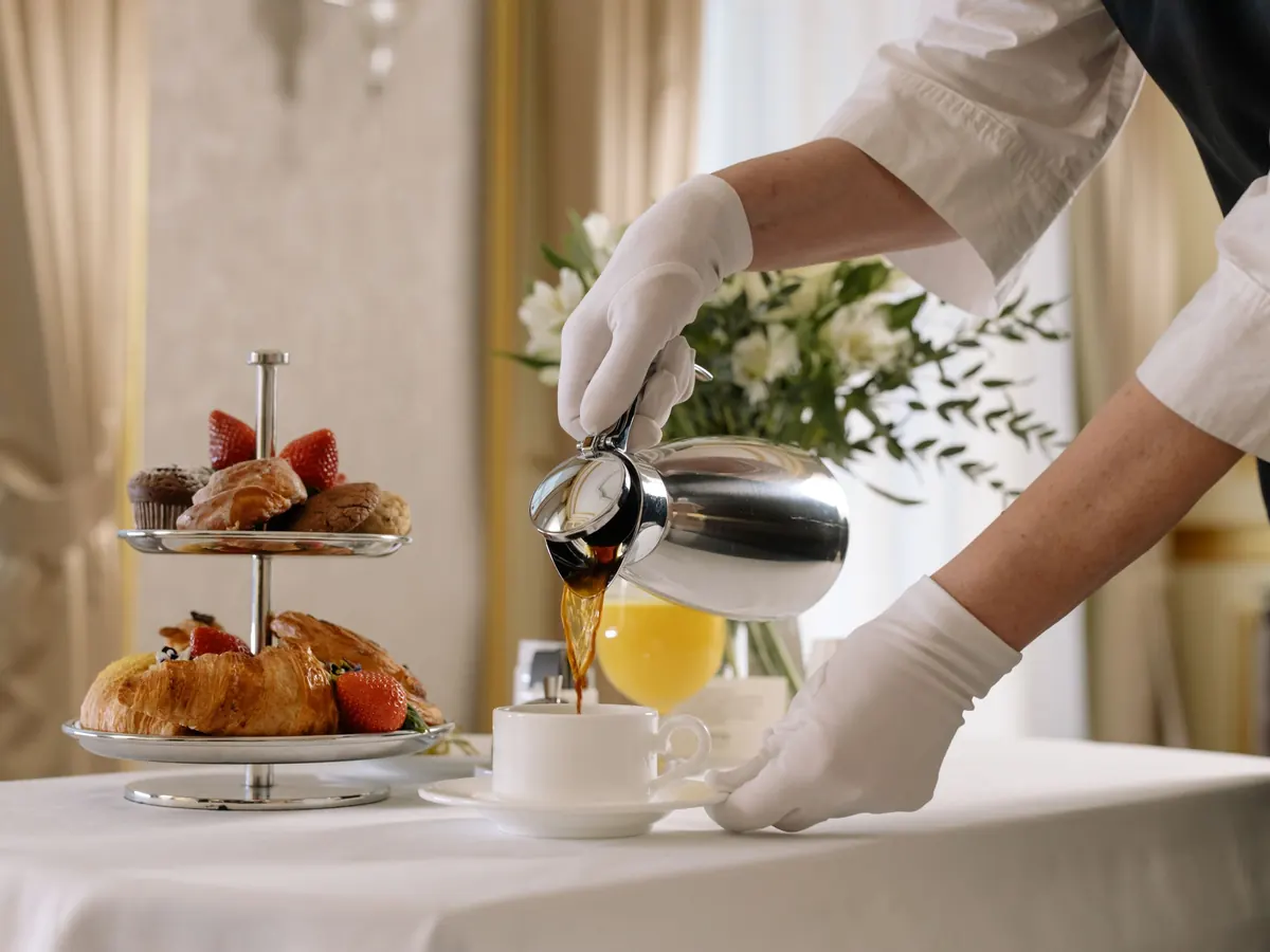 Breakfast service with pastries and coffee