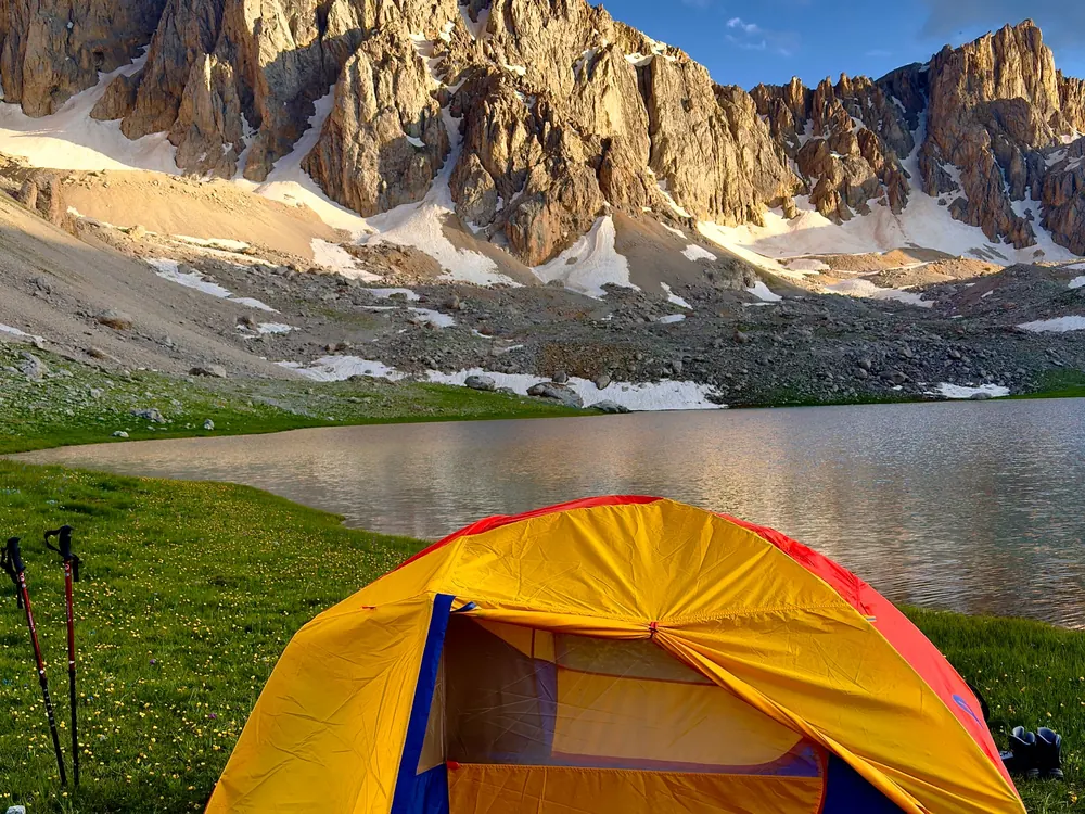 Tent by a mountain lake